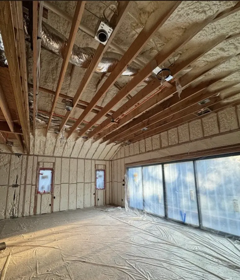 Interior walls and ceiling insulated with spray foam during new construction in Annapolis